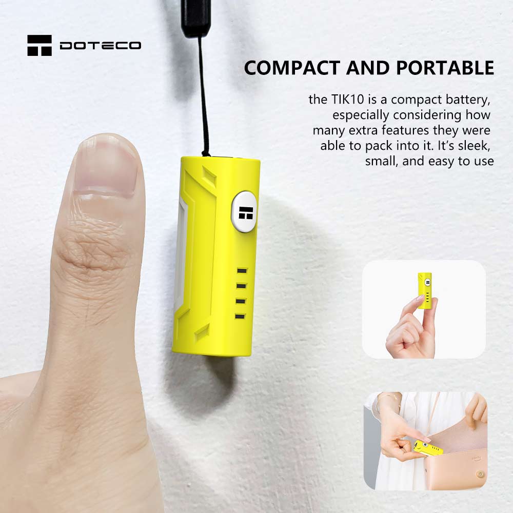 A person is holding a TIK10 Battery device with a finger on it.