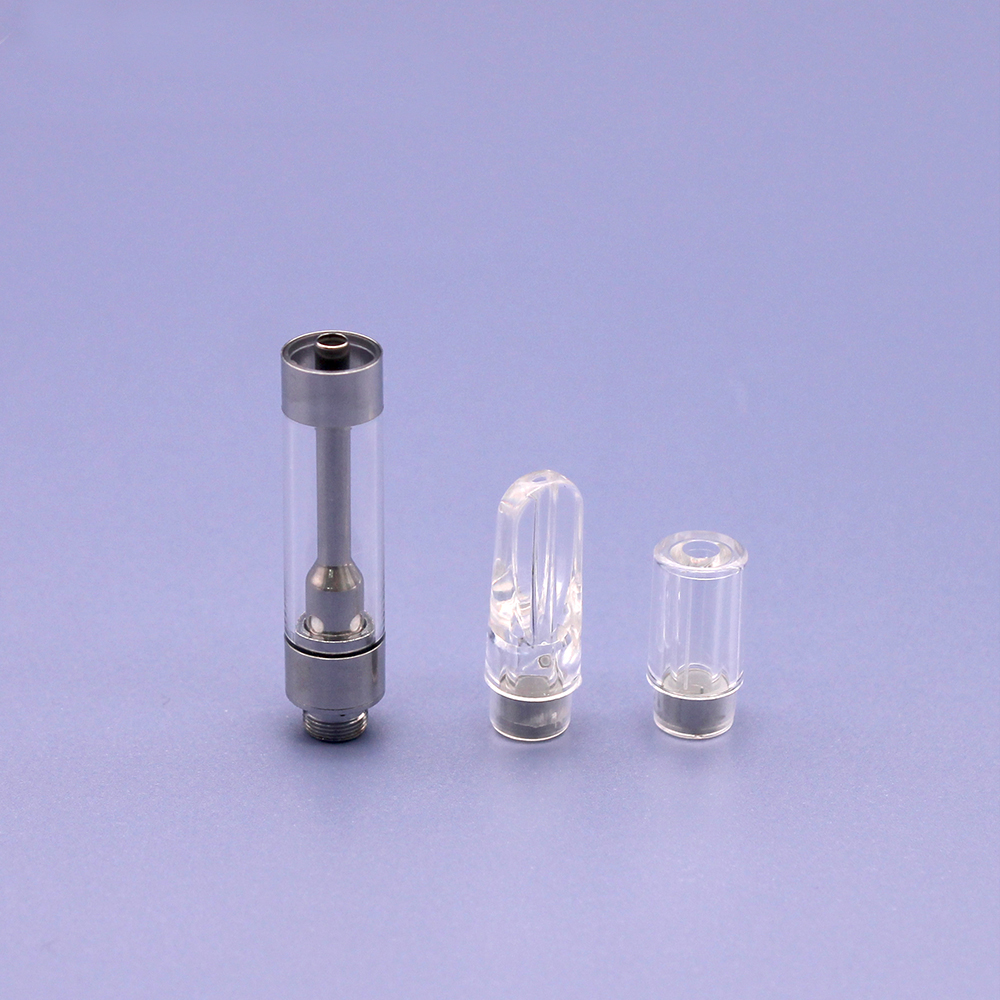 Clear glass atomizers with V10-SS - PCTG Round Tip -1ml on a blue surface.