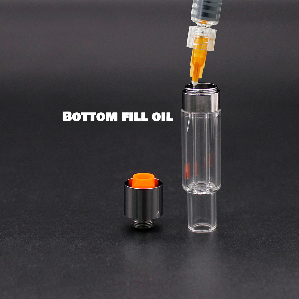The VG02 - 1ml - Full Glass all glass vape cartridge is being filled with bottom fill oil.