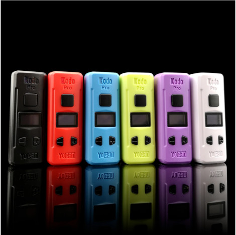 A group of different colored electronic devices, including the Yocan Kodo Pro Battery, in front of a black background.